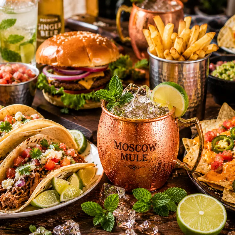 Moscow Mule cocktail served with tacos burgers and fries